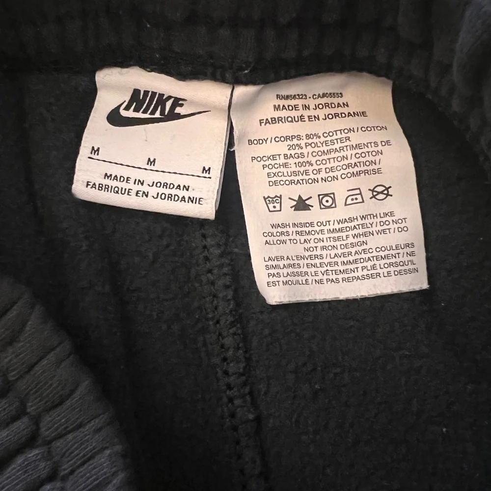 Nike Kids Black Sweatpants with White Logo